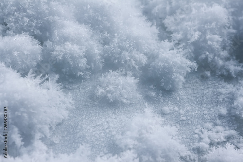 Frosty pattern on ice  winter season background  macro shot.