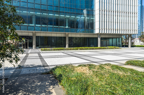 beautiful green field near modern office building.