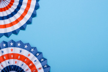 4th of July USA flag theme paper fans on blue background. Independence Day lanterns template.