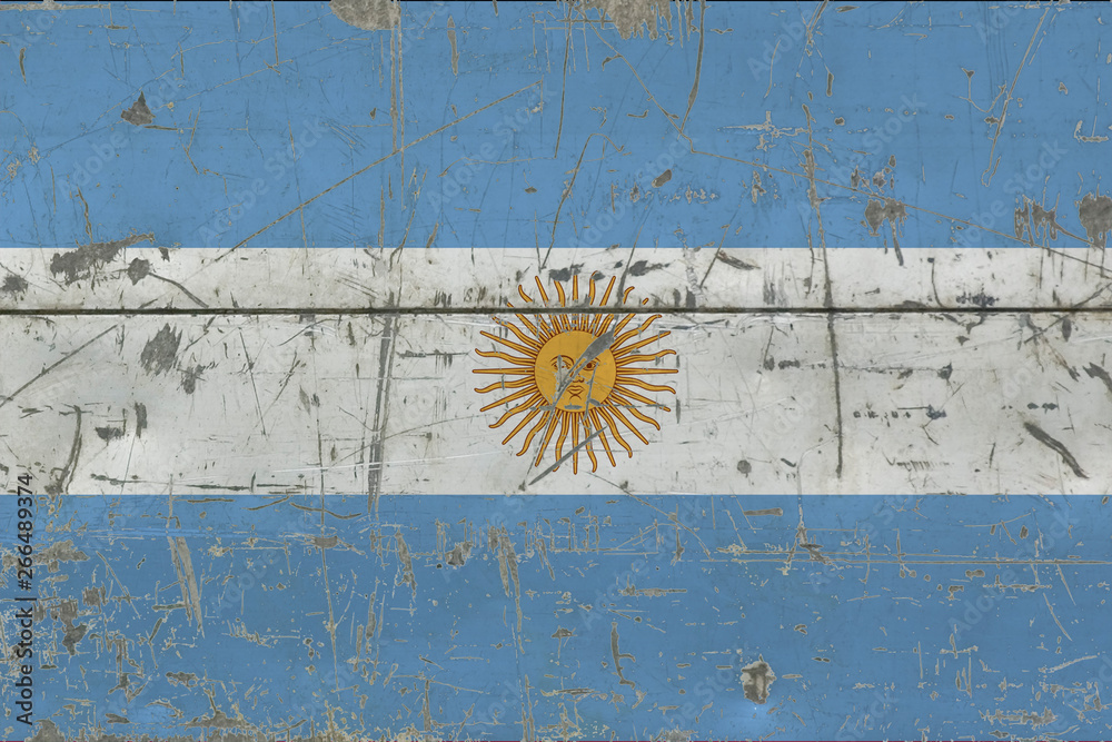 Grunge Argentina flag on old scratched wooden surface. National vintage background.