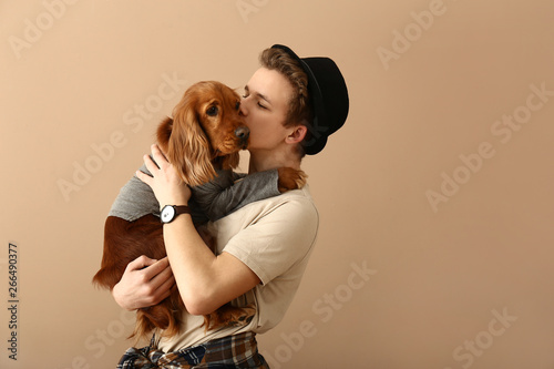 Teenage boy with cute dog o...