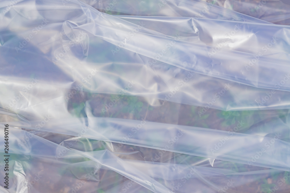 The texture of the transparent polyethylene package. a surface covered with multiple layers of  cellophane.