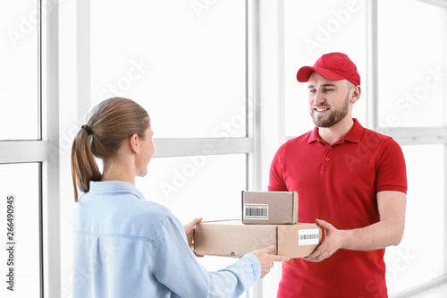 Woman receiving parcels fro...