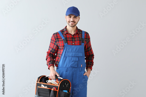 Male electrician with tools...