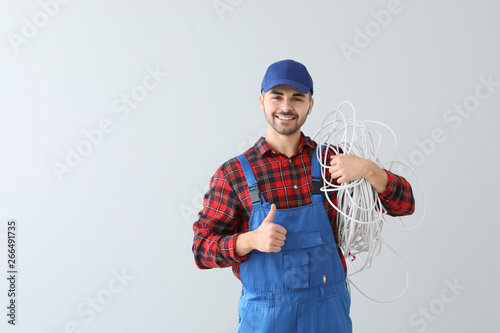 Male electrician on light b...