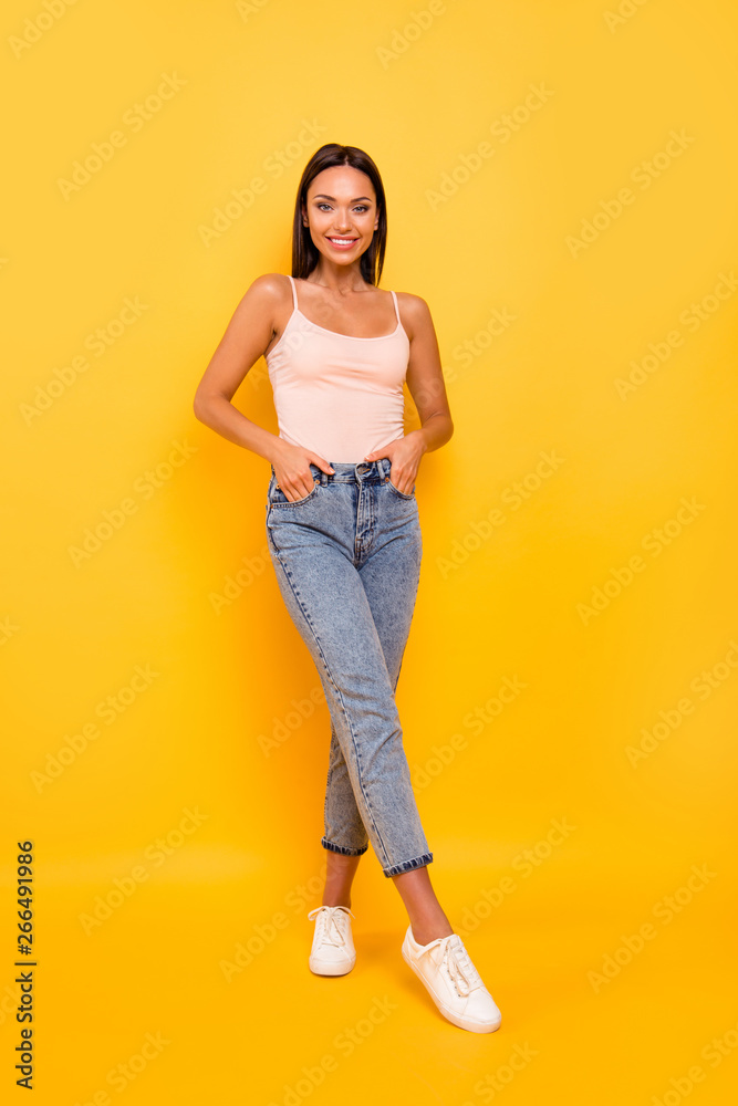 Vertical full length body size photo beautiful amazing she her lady ideal shape figure sunny weather walk park town city square wear casual pastel tank-top clothes isolated yellow bright background Vertical full length body size photo beautiful amazing she her lady ideal shape figure sunny weather walk park town city square wear casual pastel tank-top clothes isolated yellow bright background