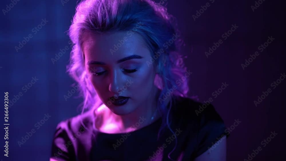 Young Blond Model is Posing in Neon Young Blond Model is Posing in Neon