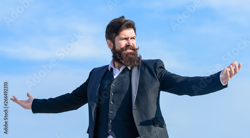 Man bearded proud himself sky background. Superiority and power. Feeling undefeated. Proud of himself. Self proud and narcissistic. Hipster bearded attractive enjoy freedom. Guy enjoy top achievement