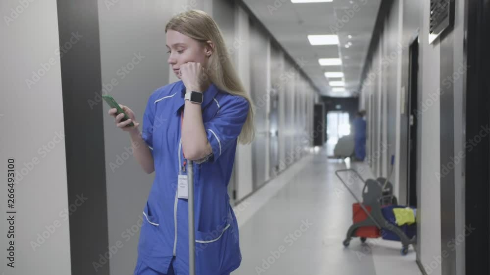 Tired female janitor having break at work Tired female janitor having break at work