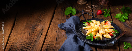 Kopytka - polish potato dumpling with strawberries photo