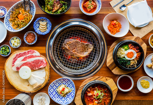 Full set of beef and pork ready for grill on stove serve with vegetable,soup and rice and side dish, Korean style barbecue