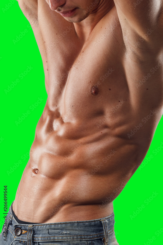 Males model poses in studio with naked torso, showing toned relief torso, isoaletd on chroma key background.