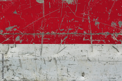 Grunge Monaco flag on old scratched wooden surface. National vintage background. © sezerozger