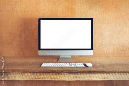 Blank Computer Monitor At Desk In home wood house Natural light