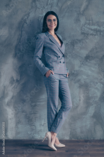 Full length body size photo beautiful she her business lady candidate interview look easy-going rest relax strict high-heels office wear specs formal-wear checkered plaid suit isolated grey background