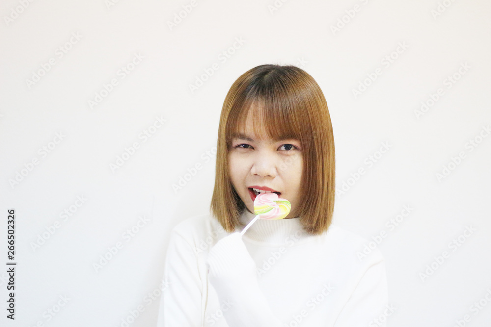 easterner girl eating colourful lollipop. easterner girl eating colourful lollipop.