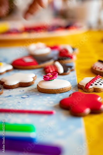 Gingerbreads decorated with icing. Appetizing colorful cookies.