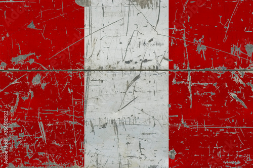 Grunge Peru flag on old scratched wooden surface. National vintage background. © sezerozger