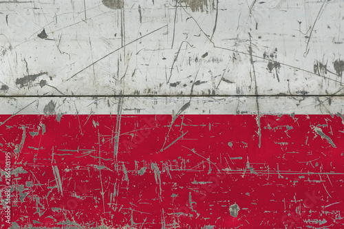 Grunge Poland flag on old scratched wooden surface. National vintage background. © sezerozger