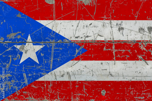 Grunge Puerto Rico flag on old scratched wooden surface. National vintage background.