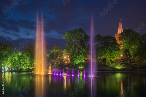 Piastowska tower and fountain in the castle pond at night in Opole, Opolskie, Poland