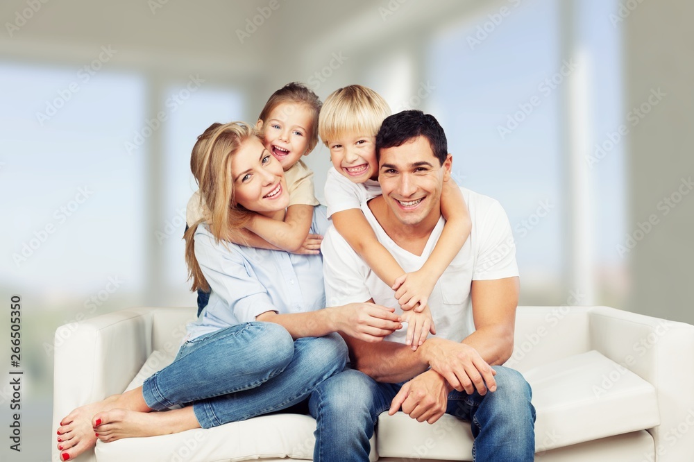 Beautiful smiling family on background Beautiful smiling family on background