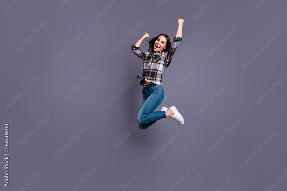 Full length side profile body size photo beautiful yell she her lady hold raise hands arms raised flight air football match game wear casual jeans denim checkered plaid shirt isolated grey background