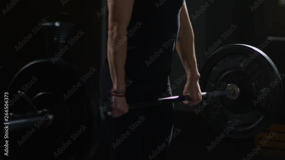 Young girl in crossfit gym working out