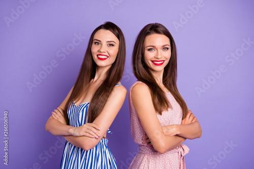 Close up portrait two people amazing beautiful she her lady classy chic freelance workers travel tourists free time enjoy wear pretty colorful dresses isolated purple violet bright vivid background