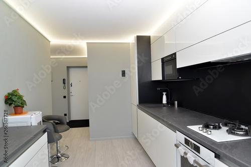 Interior of modern kitchen in gray-black tones