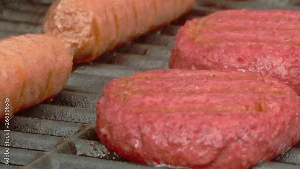 Food Cooking on Grill with Flare Ups TILT UP PAN RIGHT SLOW MOTION Food Cooking on Grill with Flare Ups TILT UP PAN RIGHT SLOW MOTION