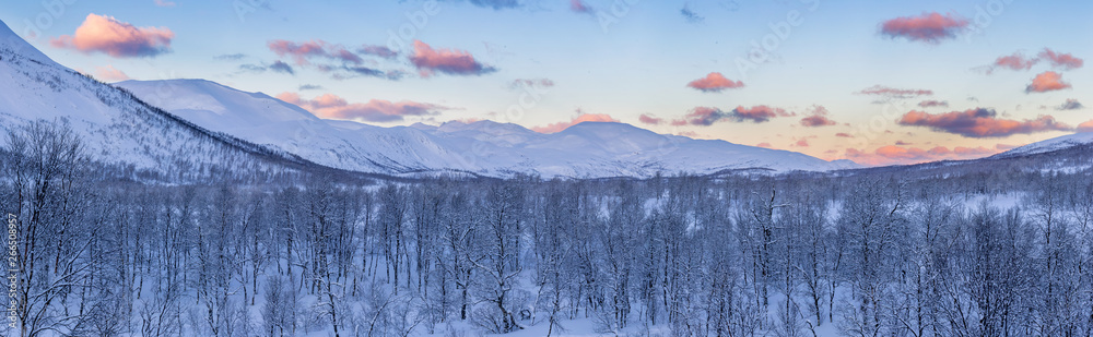 Winter panorama of northern mountains in sunrise