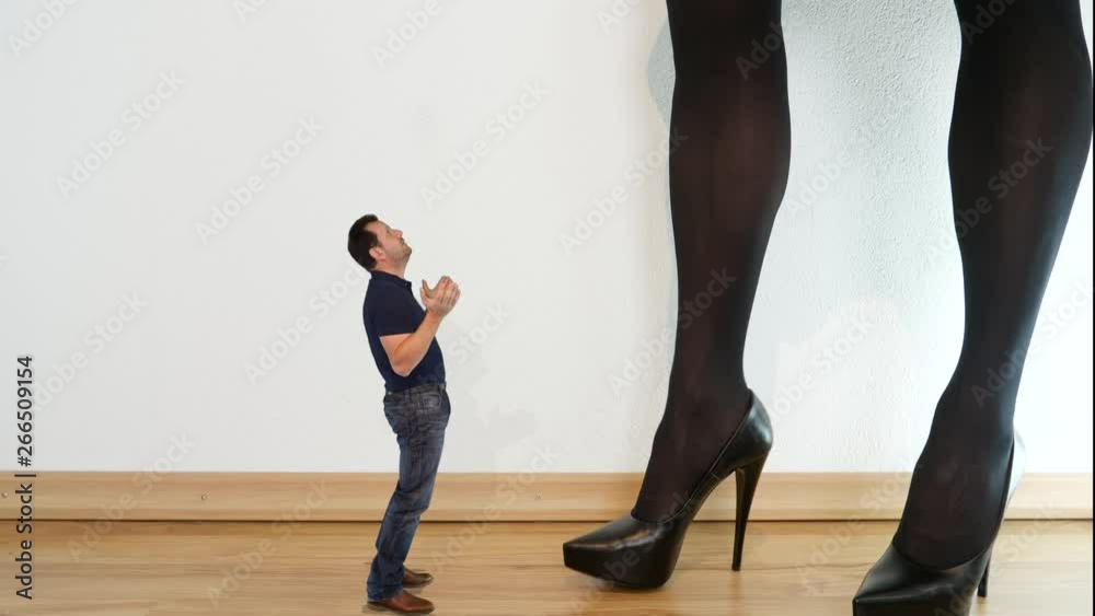 tiny mad man gets crushed by a sexy big woman through her sexy high heeled stiletto pumps.
