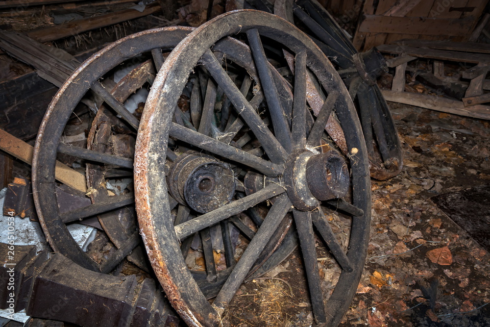 old rusty wagon wheels in a barn