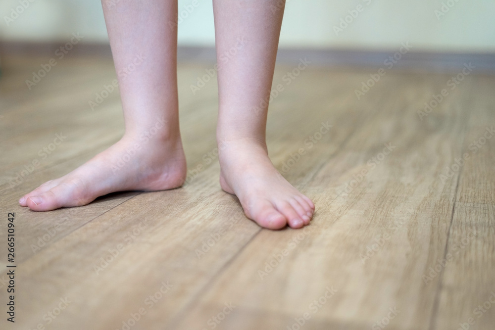 Children's feet on floor