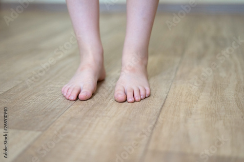 Children's feet on floor