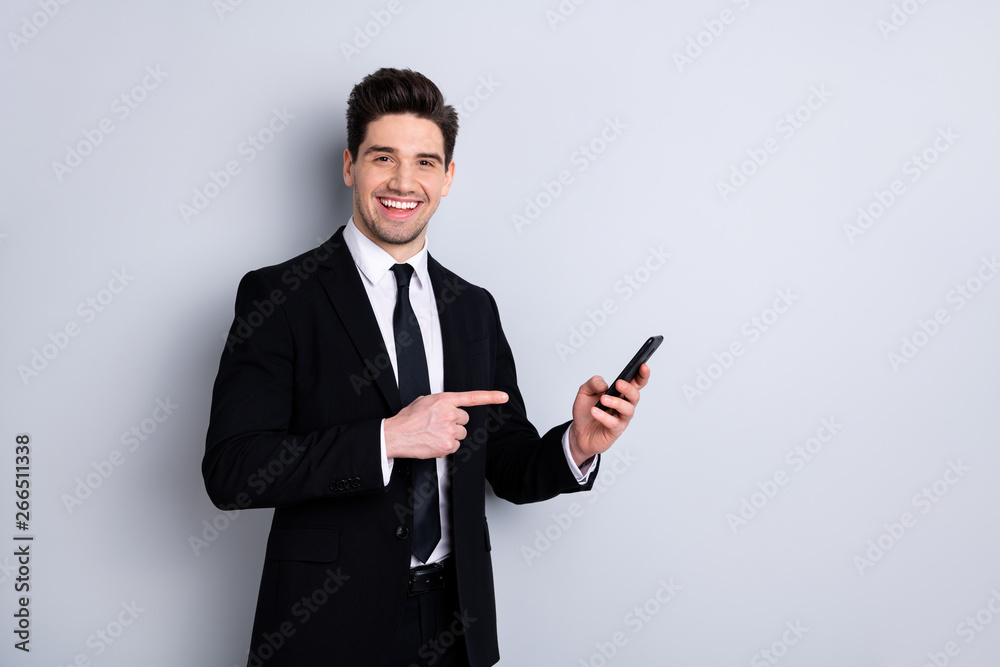 Portrait sales representative demonstrate new product option give feedback attention advice information feel excited enjoy advertising concept wear black jackets stylish isolated grey background Portrait sales representative demonstrate new product option give feedback attention advice information feel excited enjoy advertising concept wear black jackets stylish isolated grey background