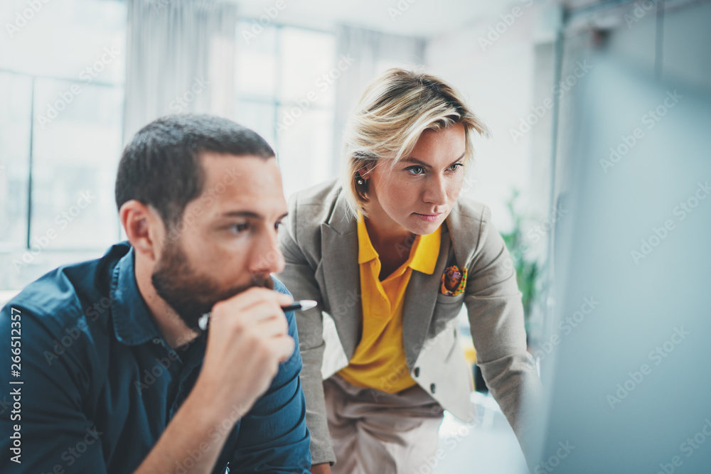 Fototapeta premium Coworkers team at modern office.Young business crew working with new startup idea studio.Blurred background