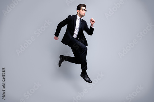 Full length body size view portrait of his he nice elegant imposing attractive worried guy diplomat white collar running fast career growth isolated on light gray background