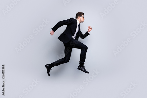 Full length body size profile side view portrait of his he nice elegant attractive confident guy diplomat white collar running fast career growth isolated over light gray background