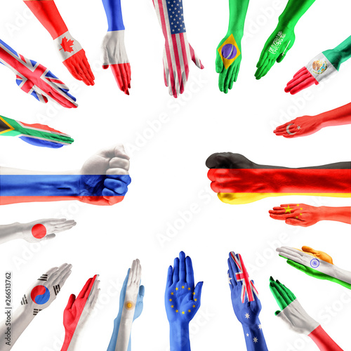 Hands colored in flags of participating countries of The Group of Twenty, major advanced and emerging economies on white background. Collage. Concept of international economical relationships. photo