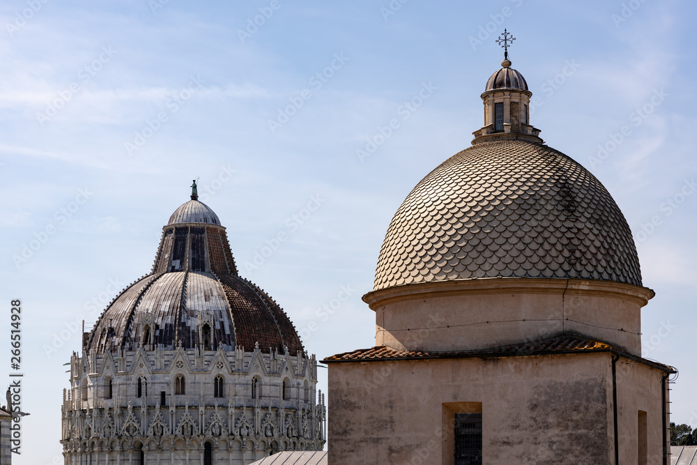 PISA, TUSCANY/ITALY  - APRIL 18 : Exterior view of the Baptistery and cathedral cupolas in Pisa Tuscany Italy on April 18, 2019