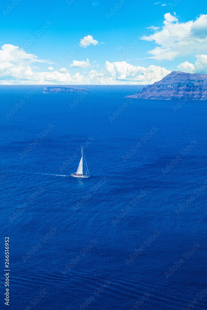 Skyline and sea with white yacht on blue background
