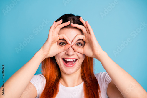 Close up photo of charming cute teen teenager make faces satisfied advice ads feedback positive laugh laughter make spectacles rest free time wear trendy stylish t-shirt isolated blue background