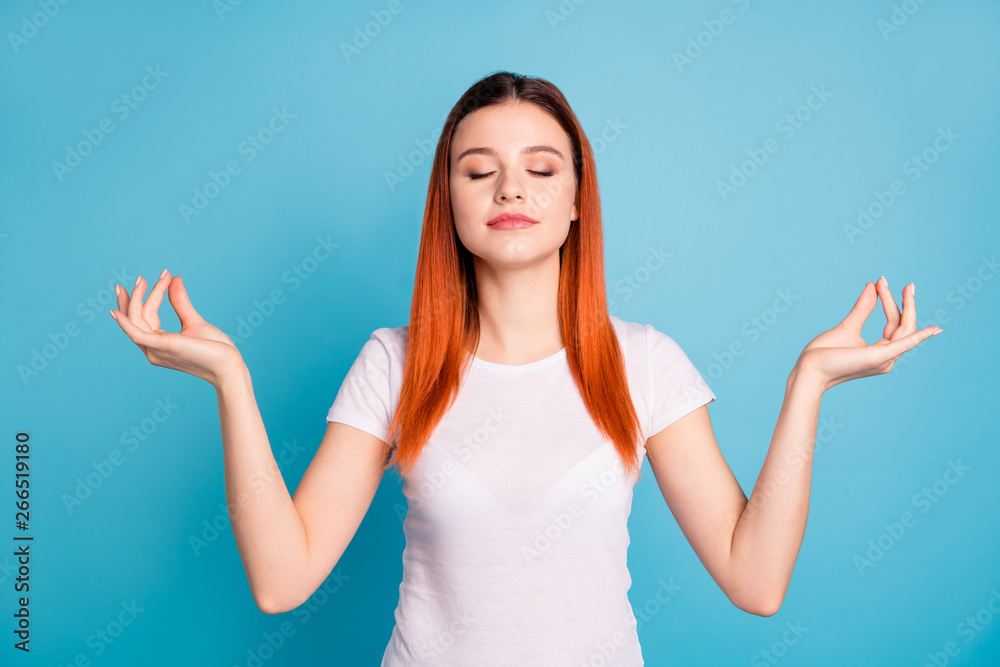 Portrait of her she nice attractive lovely peaceful girl wearing white t-shirt meditating mind creativity isolated over bright vivid shine blue background Portrait of her she nice attractive lovely peaceful girl wearing white t-shirt meditating mind creativity isolated over bright vivid shine blue background