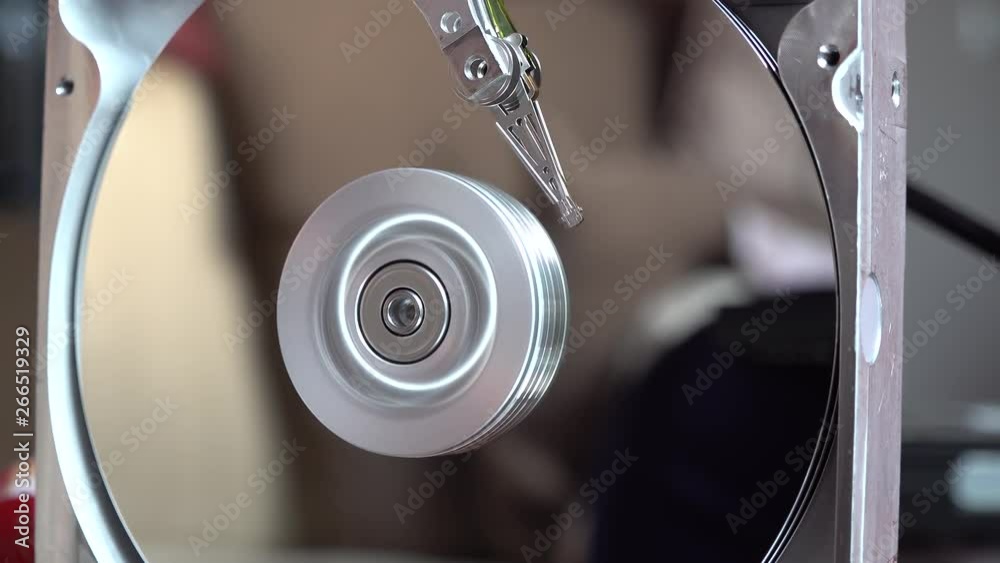 Close-up of an operating computer harddisk reading and writing data