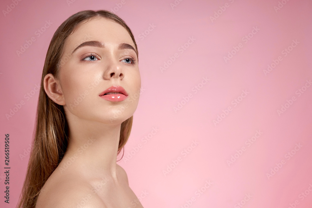 Model with plump lips, natural make up, naked shoulders. Model with plump lips, natural make up, naked shoulders.