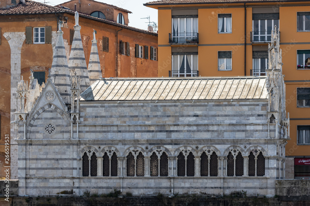 PISA, TUSCANY/ITALY - APRIL 18 : View of the Church of Santa Maria della Spina on the Arno riverbank at Pisa Tuscany Italy on April 18, 2019 PISA, TUSCANY/ITALY - APRIL 18 : View of the Church of Santa Maria della Spina on the Arno riverbank at Pisa Tuscany Italy on April 18, 2019