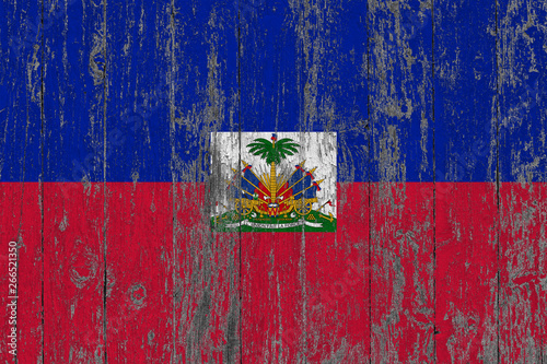Εκτύπωση καμβά Flag of Haiti painted on worn out wooden texture background.