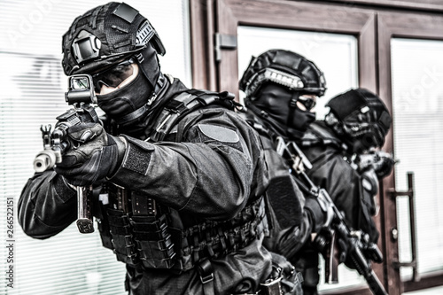 Police special operations forces fighters on raid